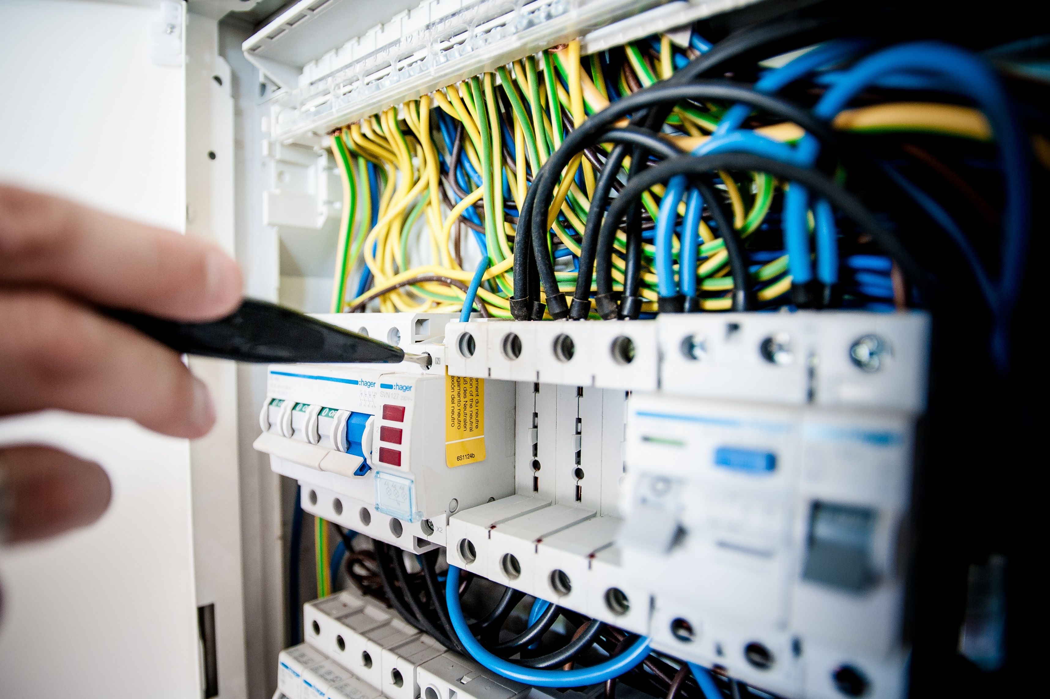 Electrician working on a circuit breaker panel